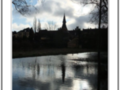 Silver reflections of a church in a river