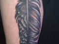 Owl feather tattoo